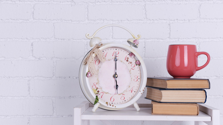 alarm clock and books