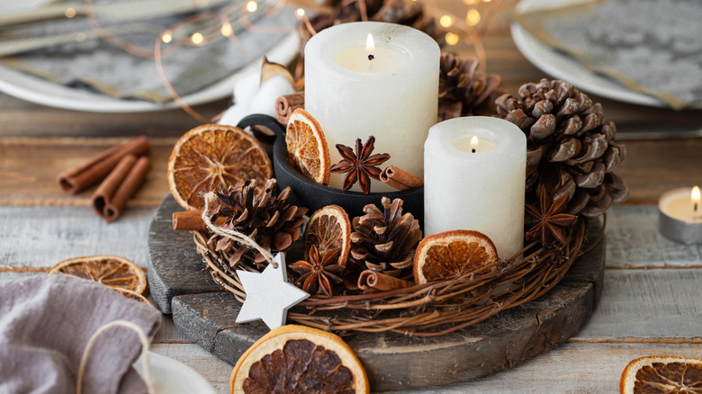 pinecone with candles and oranges