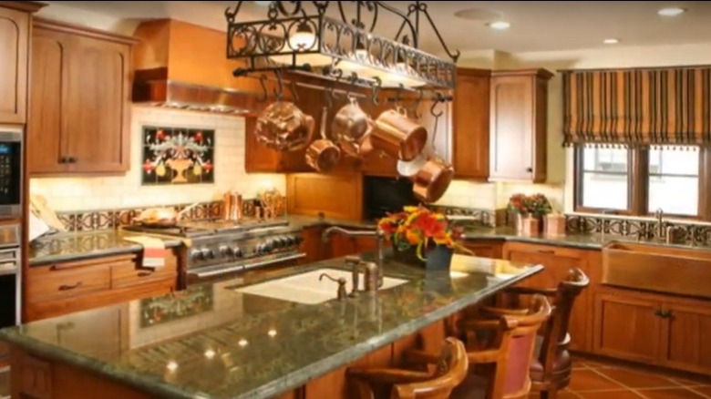 copper pots hanging from fixture kitchen