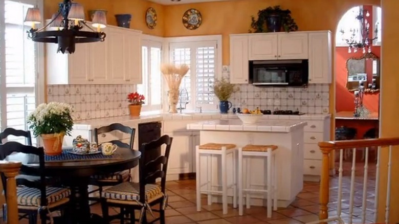 white kitchen cabinets with yellow walls