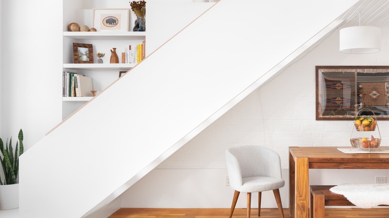 built-in shelving staircase wall