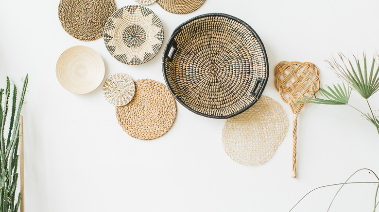 woven baskets displayed on a wall