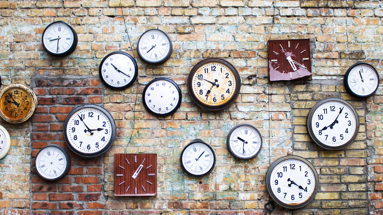 group of clocks on wall