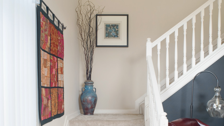 staircase wall decorated with tapestry 