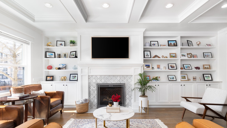 television hanging over fireplace