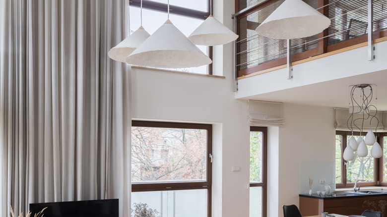 pleated light gray two story curtains