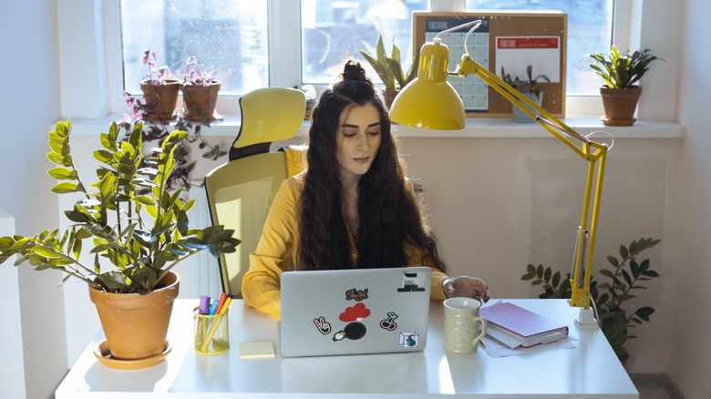 desk with yellow lamp