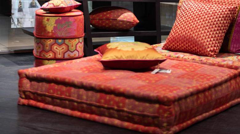 boho red pillows on ottoman