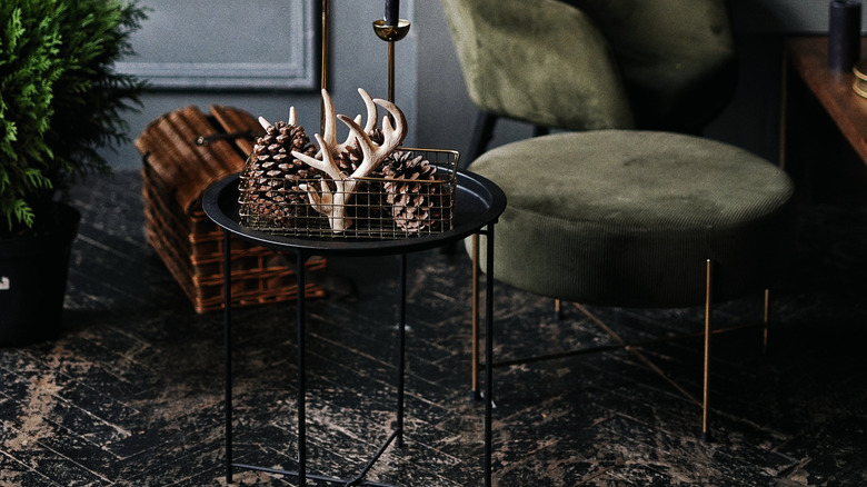 antlers and pine cones in basket