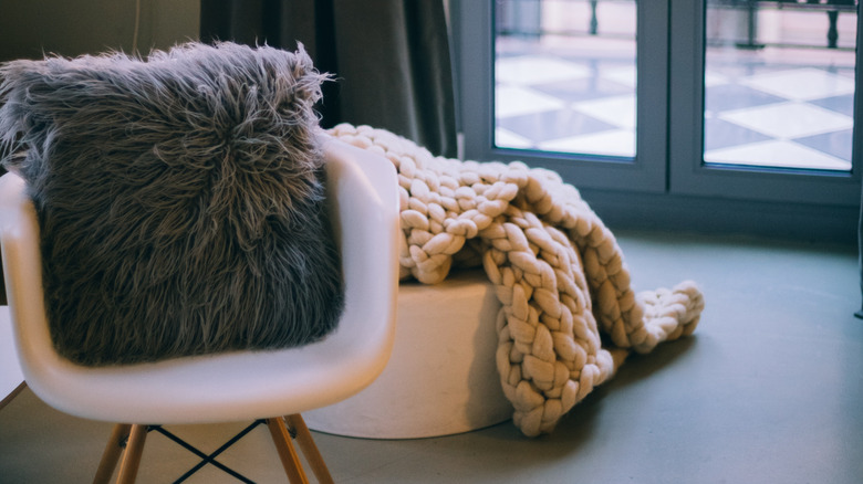 knitted wool blanket on ottoman