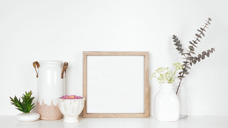 bookshelf with art and vases