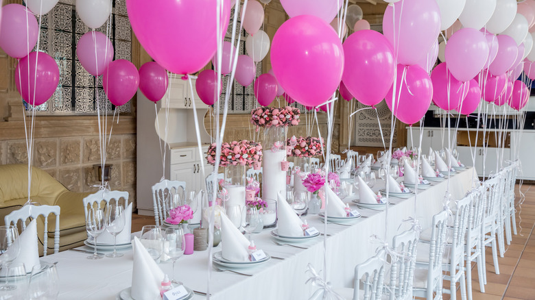 baby shower tablescape with pink balloons