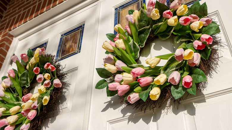 welcoming front door with flower bouquet