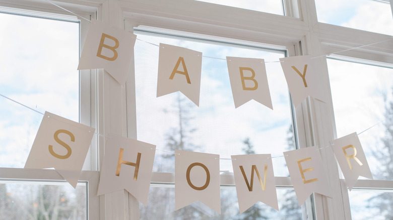 baby shower banner on window