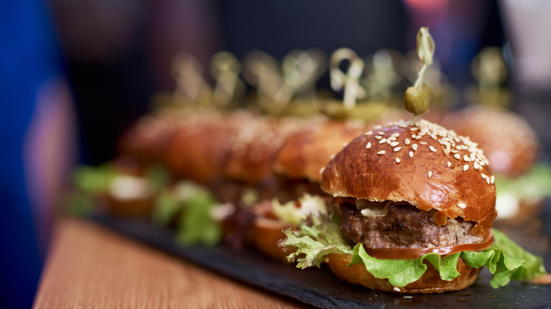 burger sliders on long serving plate