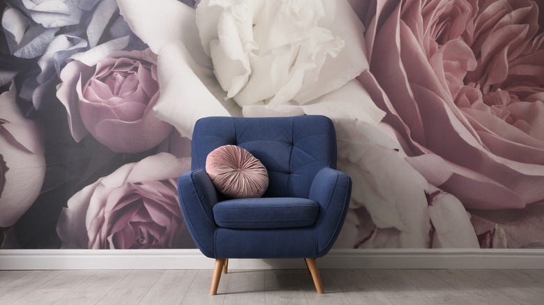 floral wallpaper by blue couch