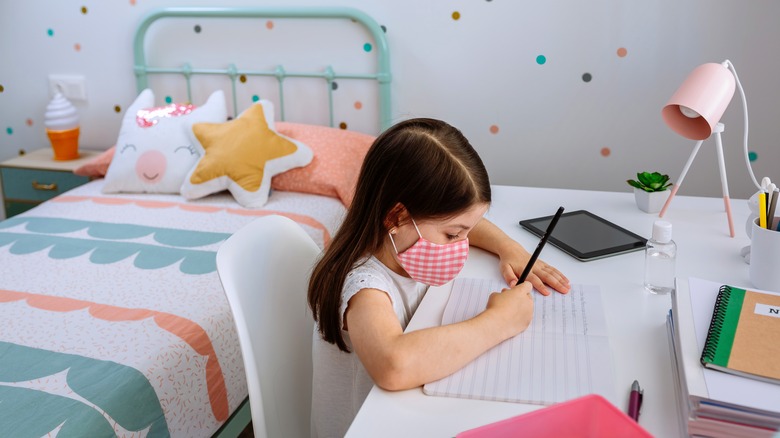 Girl in polka dotted room 