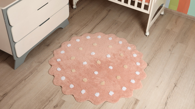 Polka dotted rug in nursery