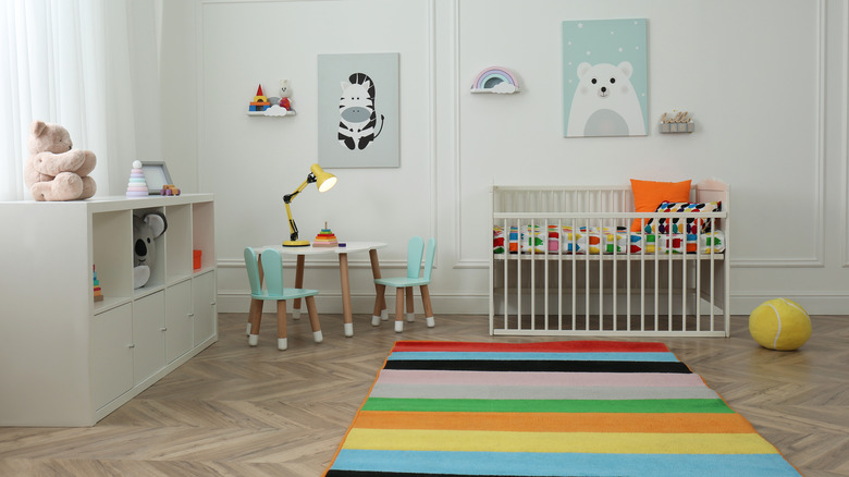 rainbow rug in baby room