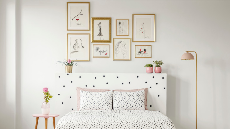 gallery wall frames above bed