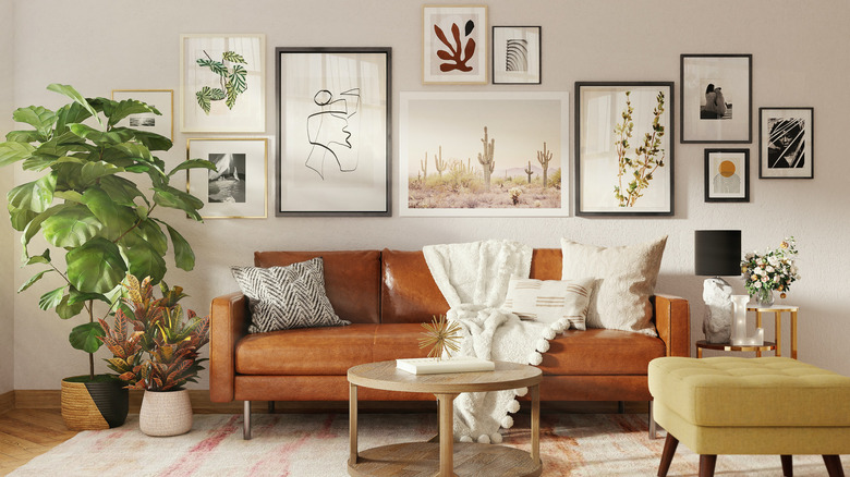 Staggered framed art over sofa