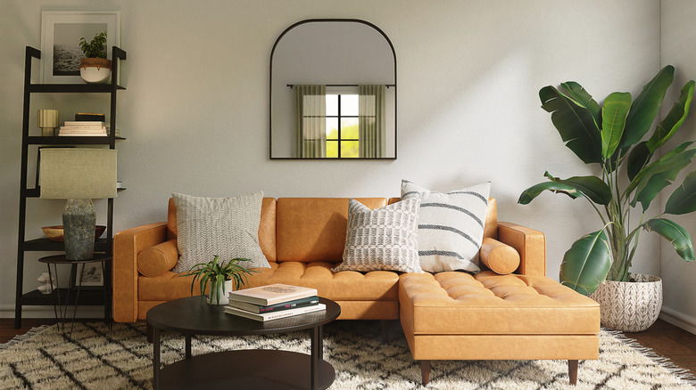 black frame mirror over sectional 