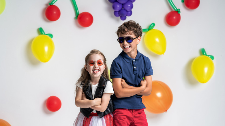 kids with fruit balloons