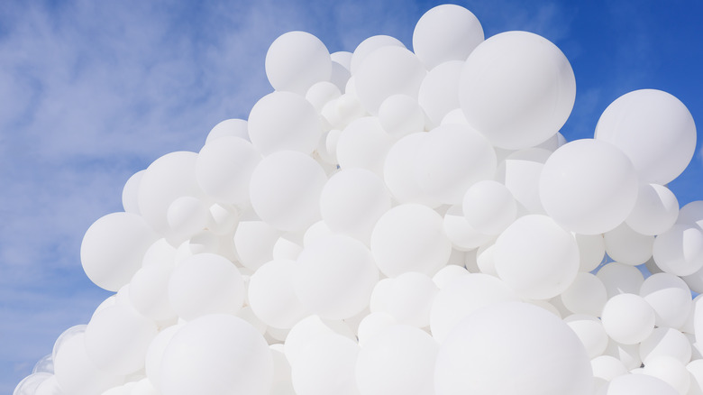 white balloons in the sky