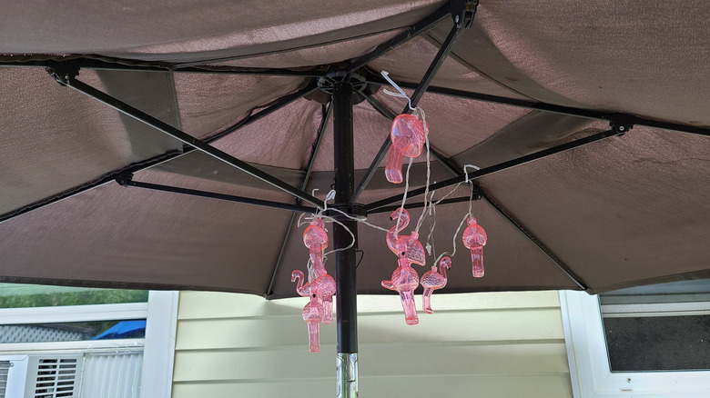 flamingo string lights under umbrella