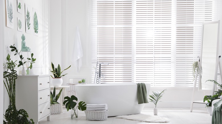 Bathroom with leaf and plant designs 