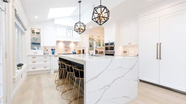 white marble kitchen with gold