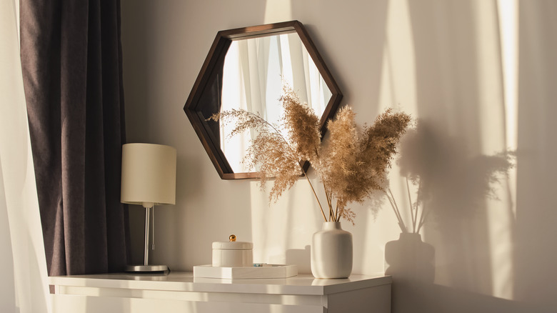 pampas grass in vase with mirror