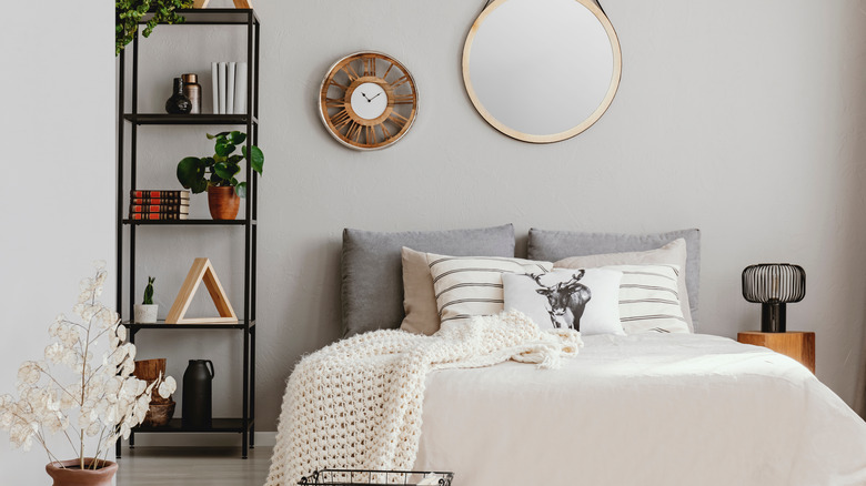 bedroom shelf styled with pottery 