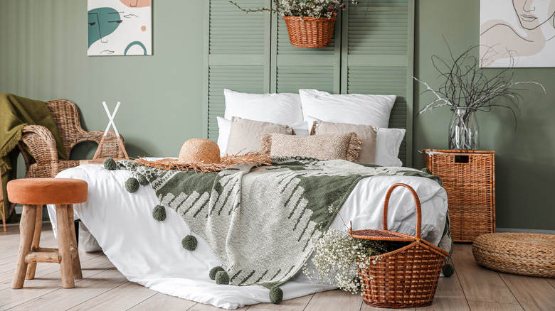 orange stool at foot of bed