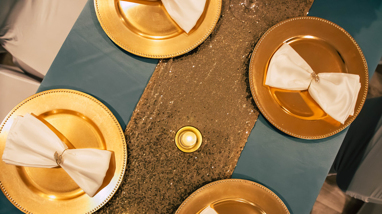 metallic table runner with gold plates