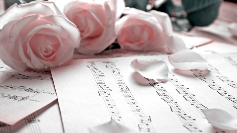 music sheets with pink roses