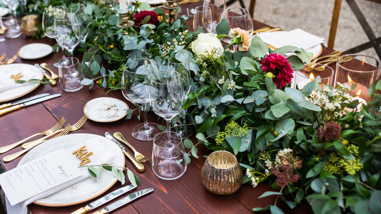 greenery with plates on table