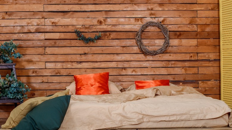 bedroom with wood pallet wall