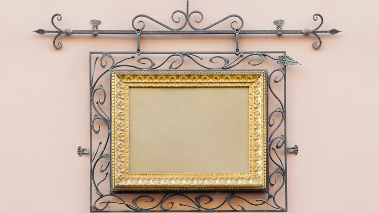 wrought-iron frame on a wall