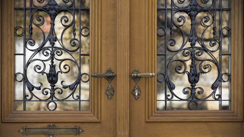 wrought-iron door grille sits over windows