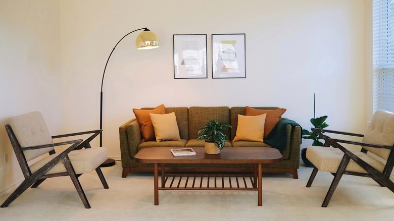 living room with large arched lamp