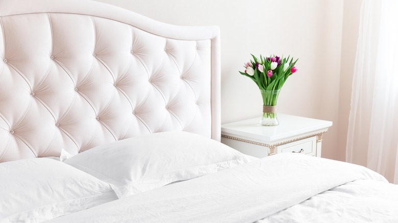 white bed with flowers