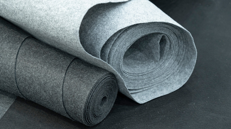 rolls of gray carpet