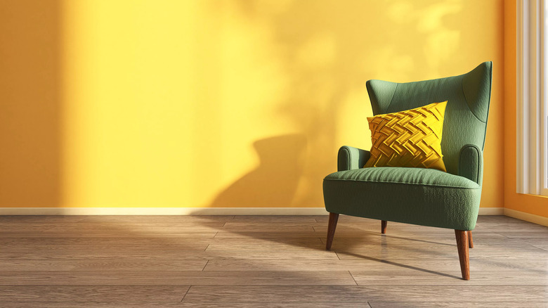 yellow wall with green chair