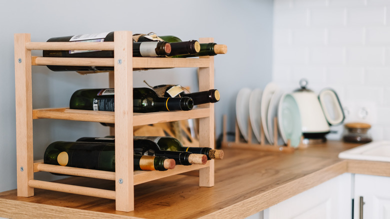 wooden wine rack with bottles