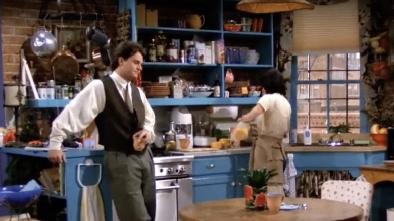 friends standing in kitchen