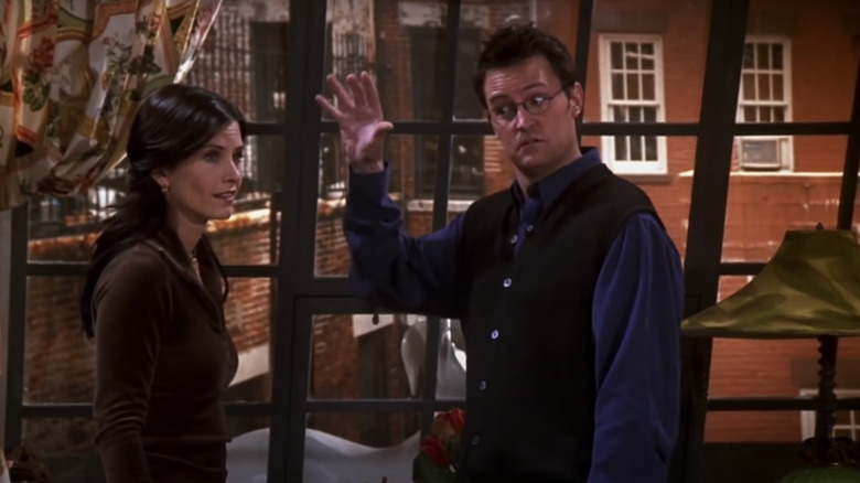 Monica and Chandler by window