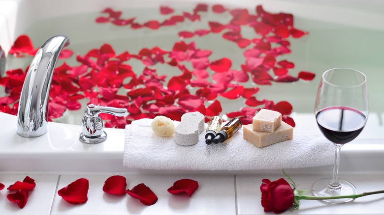 red rose petals in bathtub