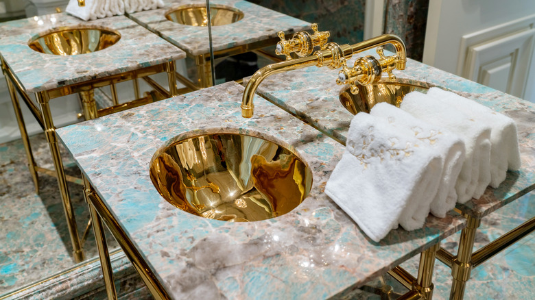gold sink and bathroom hardware