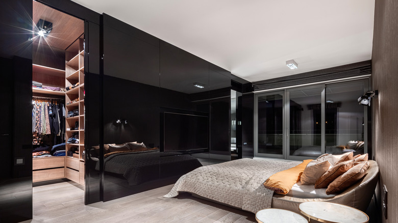 Modern bedroom with black wall